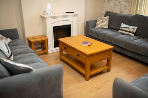 Three large sofas and coffee table