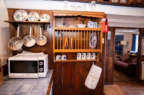 Kitchen with microwave and plate rack