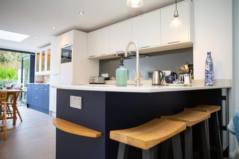 Kitchen with breakfast bar and stools