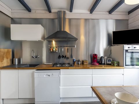 Countertop, Cabinetry, Property, Kitchen Sink, Kitchen, Kitchen Appliance, Kitchen Stove, Lighting, Wood, Interior Design