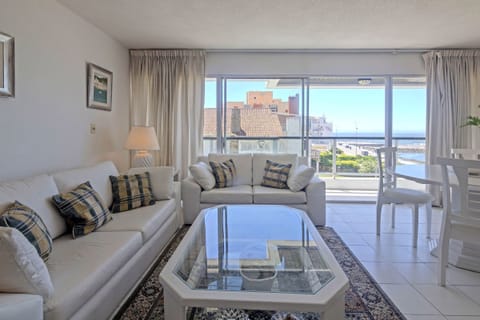 Family Apartment, Ocean View | Living area | 40-inch Smart TV with cable channels