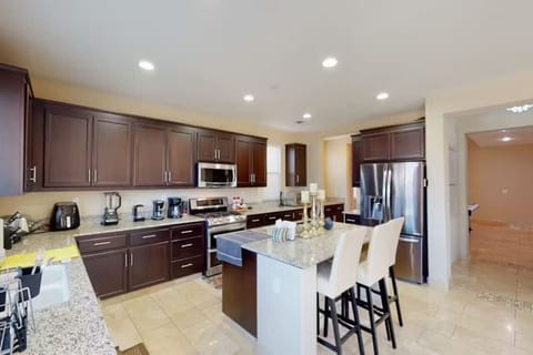 Fully equipped kitchen with large island and modern appliances