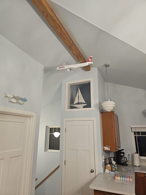 Laundry door & top of stairs to main floor living room and kitchen, bath and bed