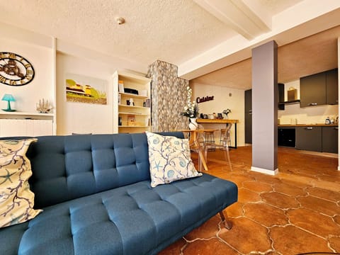 Deluxe Apartment, Courtyard View | Living area | 28-inch flat-screen TV with cable channels