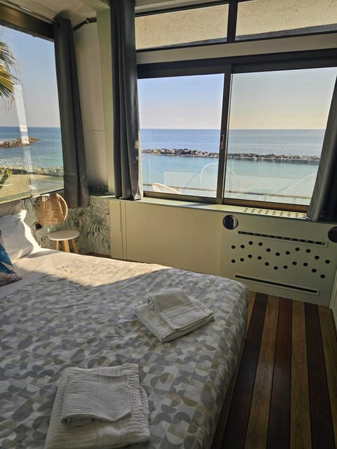 Deluxe Room, Balcony, Sea View | Minibar, in-room safe, desk, free WiFi