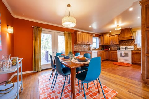 Dining area and kitchen with beverage cart on the side