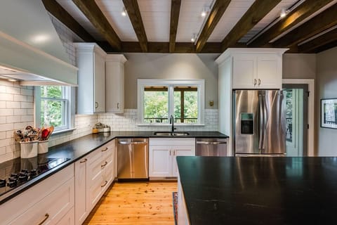 Fully stocked Kitchen is a home cooks dream - two wall ovens, two dishwashers, toaster oven, microwave, and an ice machine. There's a second full size refrigerator in the lower level.