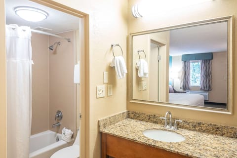 Standard Room, 1 King Bed, Refrigerator & Microwave | Bathroom | Combined shower/tub, free toiletries, hair dryer, towels