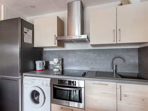 Sky, Plant, Cloud, Street Light, Urban Design, Road Surface, Tree, Building, Landscape, Road