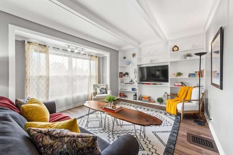 Inviting living space w/ plush sofa, vibrant pillows & open layout for easy lounging