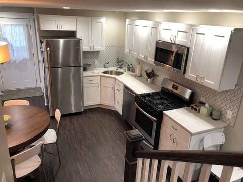 Back foot enters into flat kitchen.