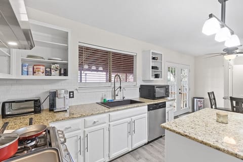 Large granite counter tops and open range for cooking a delicious meal at home!