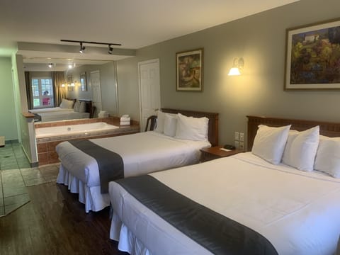 Family Suite, 2 Queen Beds (Whirlpool Bath) | Premium bedding, desk, laptop workspace, blackout drapes