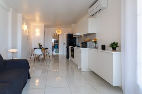 Bright living space with an open modern kitchen, dining area, and lounge, offering a welcoming and functional atmosphere.