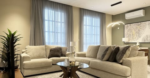 Design Apartment, 3 Bedrooms | Living area | Flat-screen TV