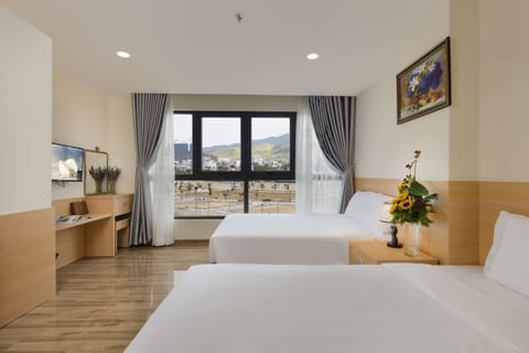 Deluxe Triple Room, City View | Desk, free WiFi, bed sheets