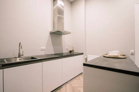 The fully equipped shared kitchen space, featuring modern appliances for a comfortable cooking experience.