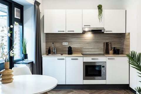 A fully-equipped kitchen with modern appliances, ready for all your cooking needs. Enjoy the spacious and functional layout.