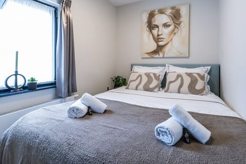 Relax in a stylish double room with soft bedding, fresh towels, and modern décor.