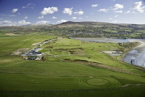 Golf links with Newport Estuary and town beyond, beach to the right