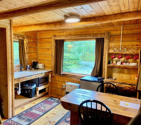 Snoozin Moose Cabin | Living area | 32-inch Smart TV with digital channels, books, streaming services