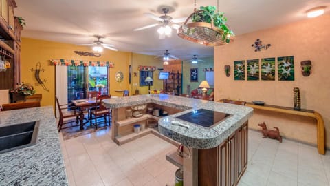 Deluxe Suite, 1 King Bed, Pool View | Private kitchen | Full-size fridge, microwave, oven, stovetop