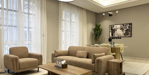 Design Apartment, 3 Bedrooms | Living area | Flat-screen TV