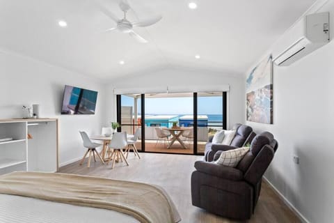 Deluxe Apartment, Bay View | Living area | 50-inch Smart TV with digital channels, Netflix, streaming services