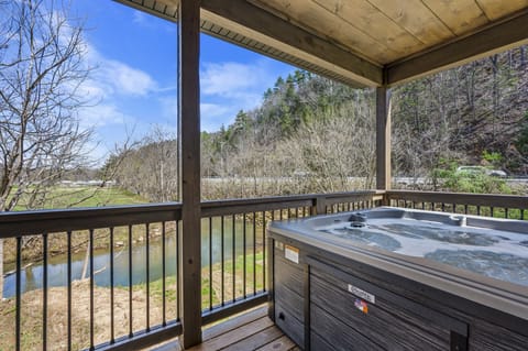 Cabin By The Creek's bubbling hot tub