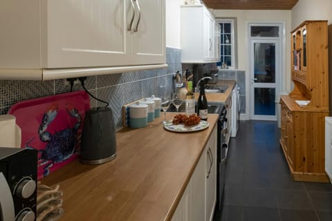 Wall and floor cabinets, kettle, Welsh dresser
