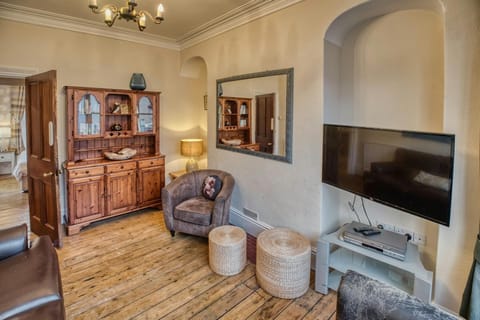 Wall mounted TV and mirror. Welsh Dresser