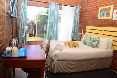 Standard Double Room, Garden View | Down comforters, individually decorated, laptop workspace
