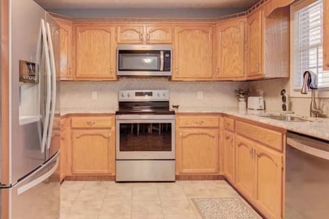 Stainless Stove, Microwave, Refrigerator and Dishwasher.