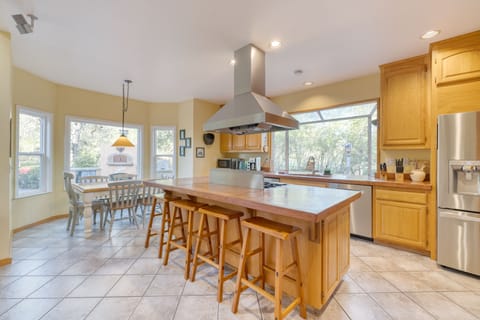 Fully equipped kitchen features stainless steel appliances. 
