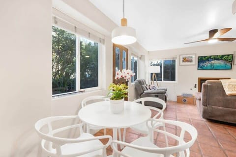 Cozy dining area for four people in the open concept living space. 