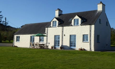 View of garden and picnic bench outside Brynceirios