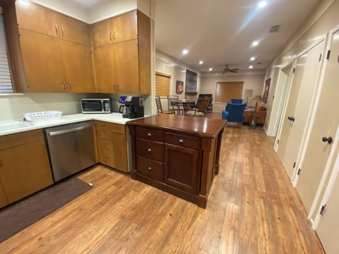 Full kitchen with stainless steel appliances -- baking stone & mixing bowl, too.