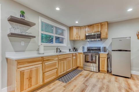 Spacious full kitchen with stainless steel appliances, large counters, and all the essentials—perfect for cooking during your vacation or extended stay.