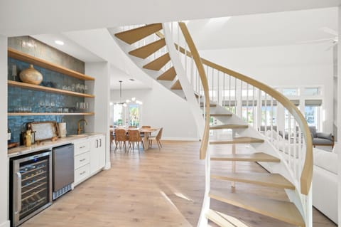 Front Entrance with Spiral Staircase and Wet Bar