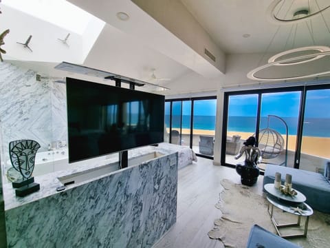 Honeymoon Condo | Living area | 50-inch Smart TV with digital channels, Netflix, streaming services