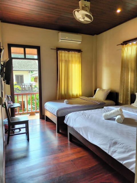 Deluxe Triple Room, 2 Bedrooms | Desk, free WiFi, bed sheets