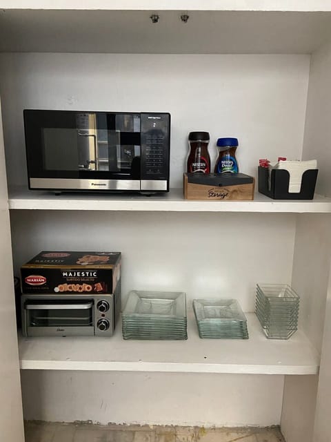 Microwave, toaster oven and some dishware