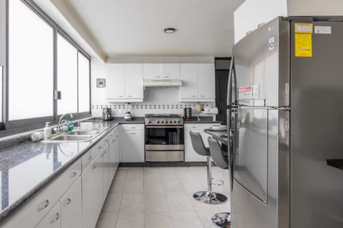 Modern kitchen with a cozy breakfast nook, perfect for casual meals or morning coffee.