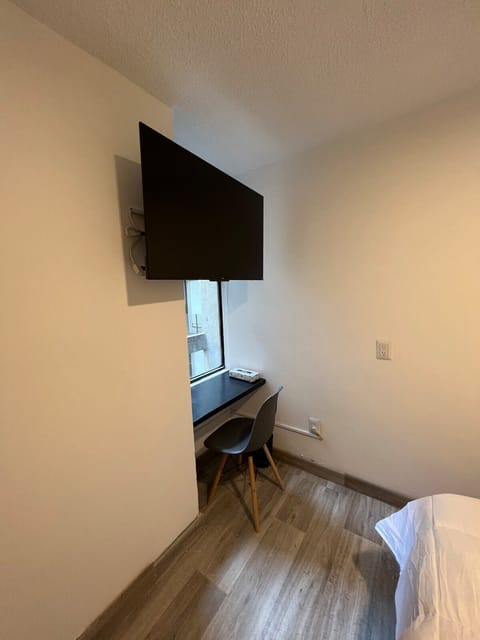 Wall-mounted TV for bedtime movies