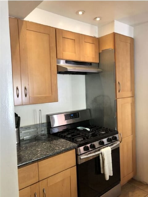 Granite, wood, and all stainless steel appliances. Bosch stove, lots of counter