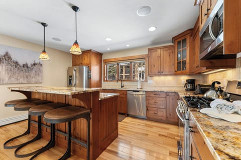 Full size kitchen featuring stainless steel appliances and granite countertops.