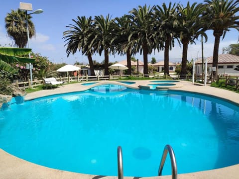 3 outdoor pools, open 11:00 AM to 8:00 PM, pool umbrellas