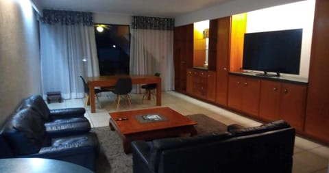 Comfort Apartment | Living area | Flat-screen TV