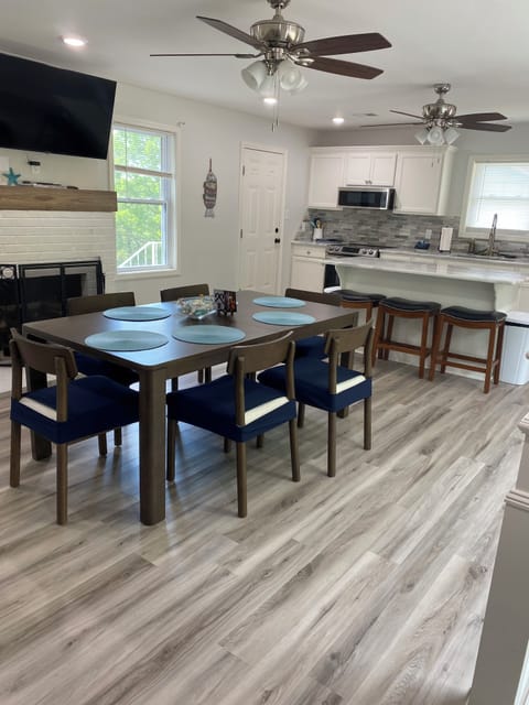 Dining room table seats 6,  3 more at the bar. Everyone eats in the same room!