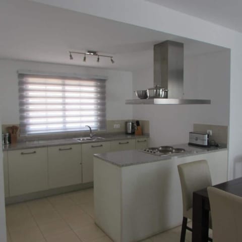 Villa | Private kitchen | Fridge, microwave, oven, stovetop